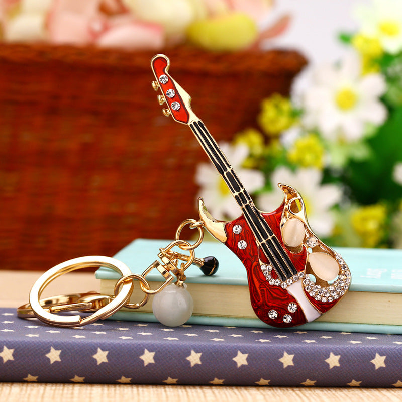 Korean version creative couple diamond studded puppy car keychain women's bag pendant metal keychain ring small gift wholesale