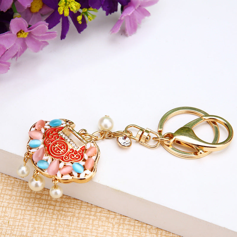 Korean version creative couple diamond studded puppy car keychain women's bag pendant metal keychain ring small gift wholesale