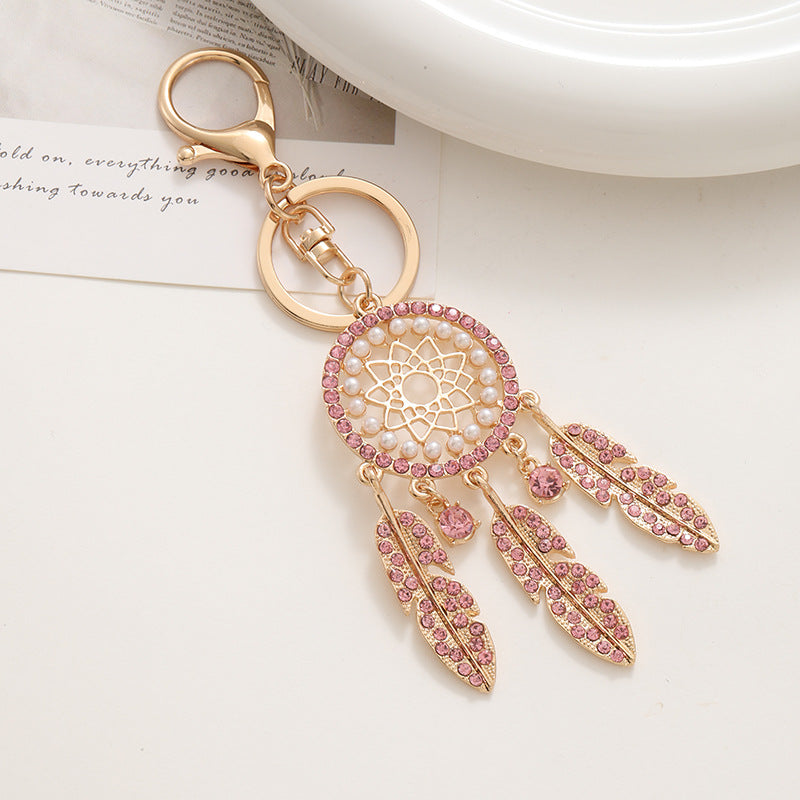 New palace style creative diamond inlaid hollow dream catcher feather keychain car bag pendant metal small gift