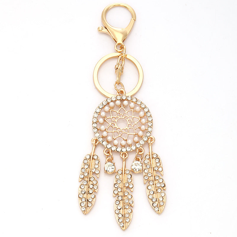 New palace style creative diamond inlaid hollow dream catcher feather keychain car bag pendant metal small gift